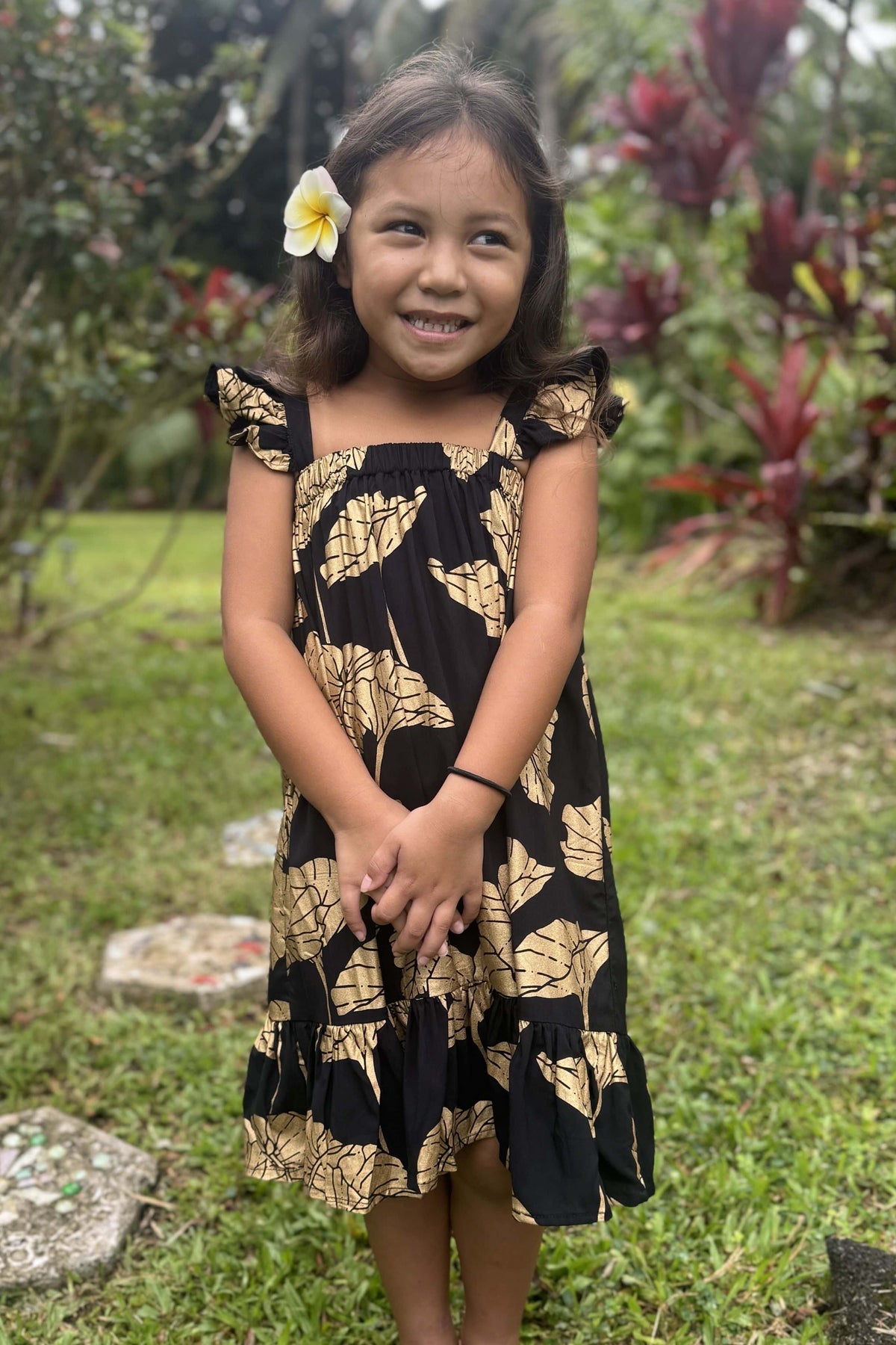 Girl's Dress in Black Gold Kalo — Front View, flutter straps and ruffle hem | Kahulaleʻa