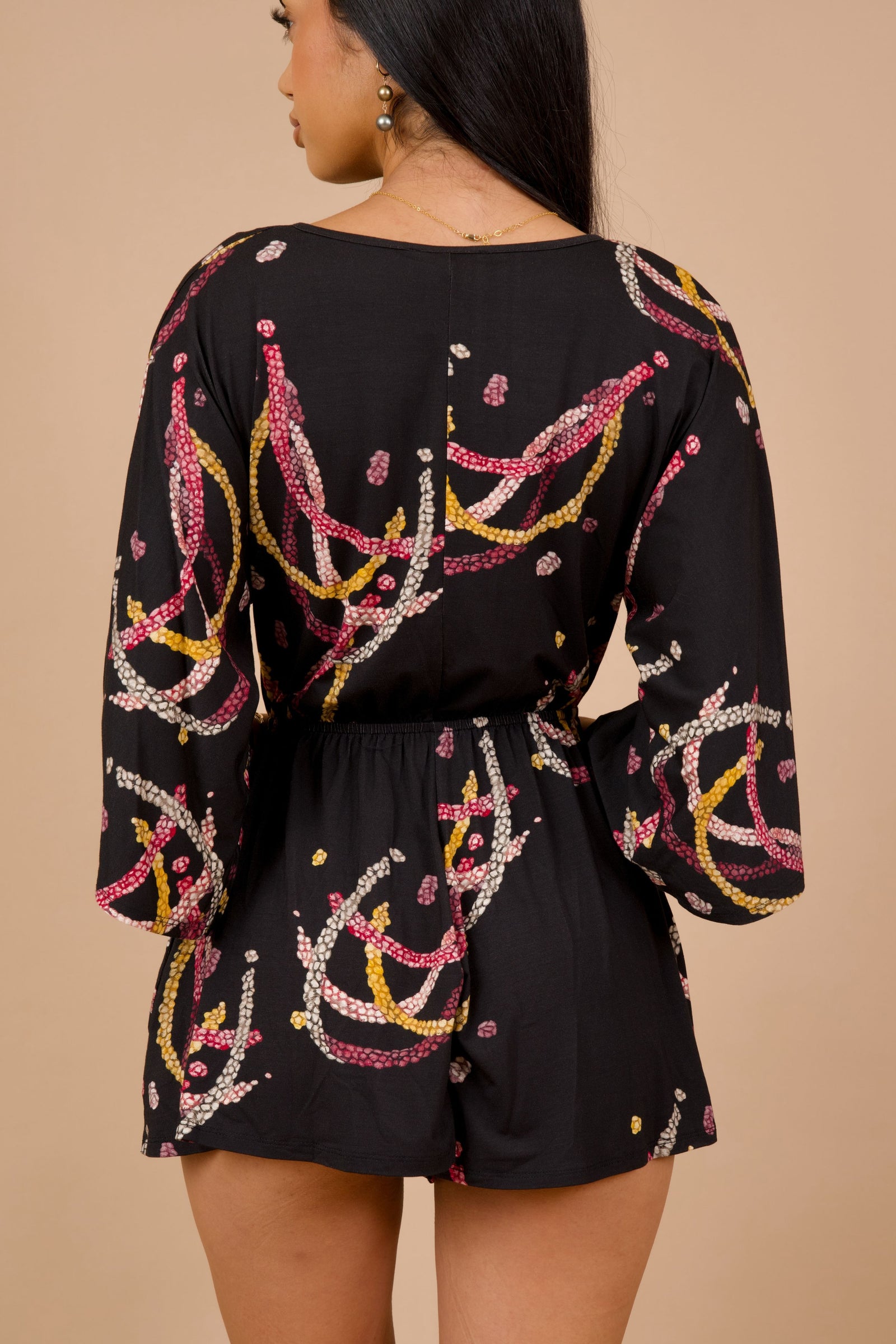 Women's Nahiku Romper in Black Lei Kahelelani - Back View | Kahulaleʻa