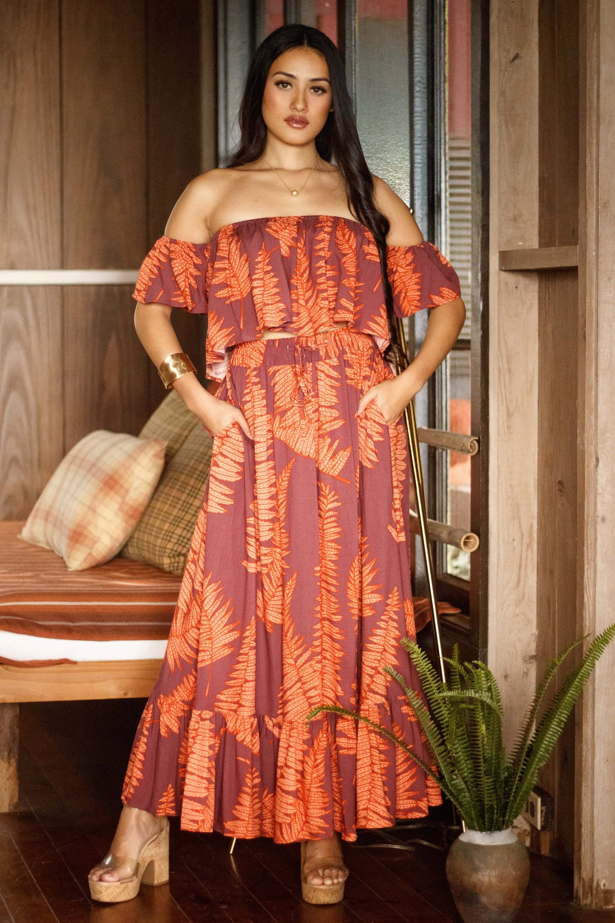 Skirt Nainoa in Ember Glow Kupukupu — Front View, hands in pockets, worn with the Top Nainoa | Kahulaleʻa