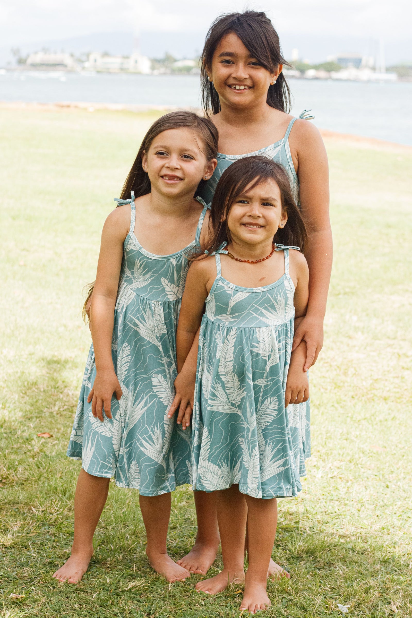 Girl's Dress in Sky Pua Manu — Front View, three sizes shown | Kahulaleʻa