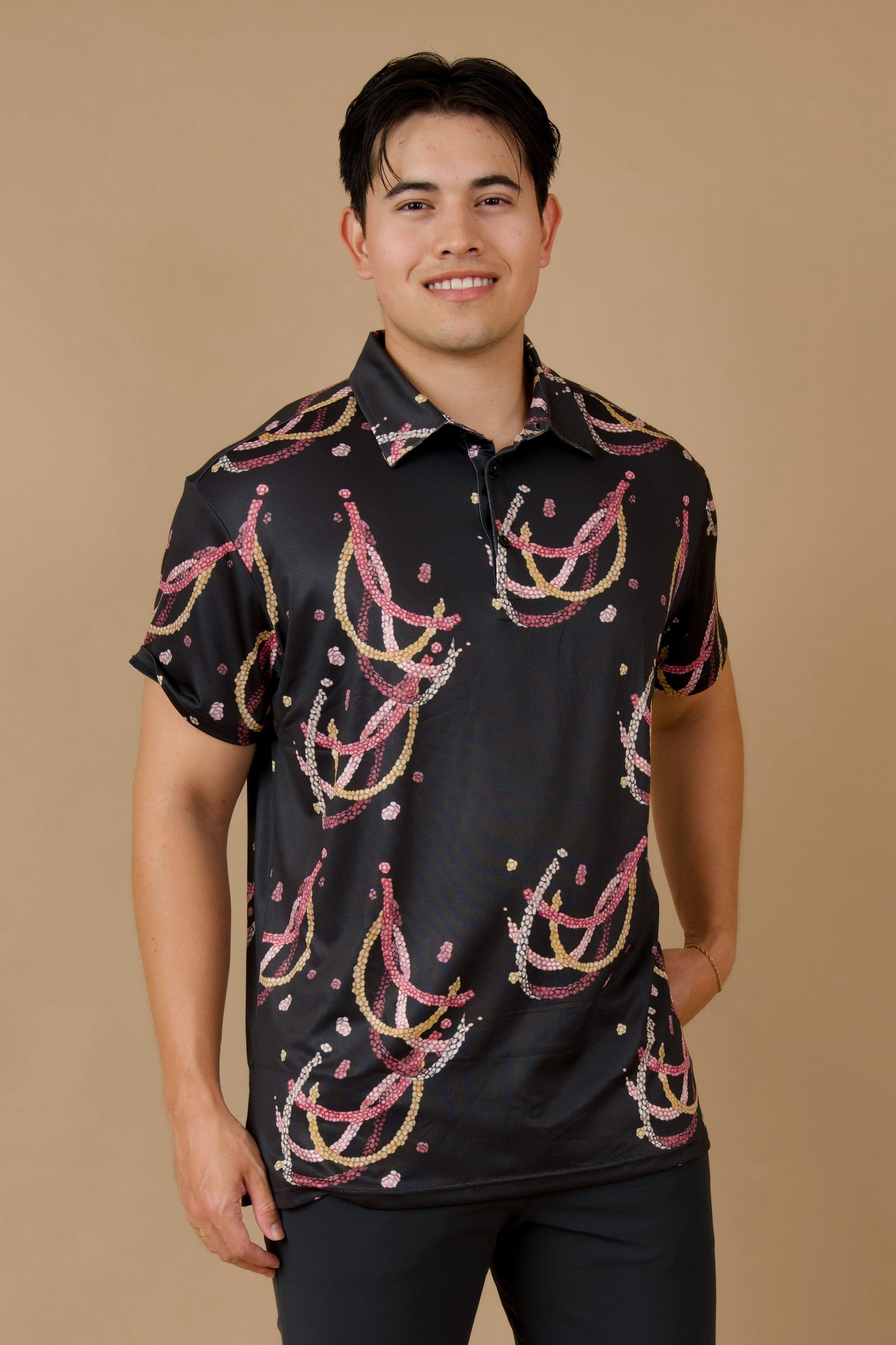 Men's Holoholo Polo Shirt in Black Lei Kahelelani - Front View | Kahulaleʻa