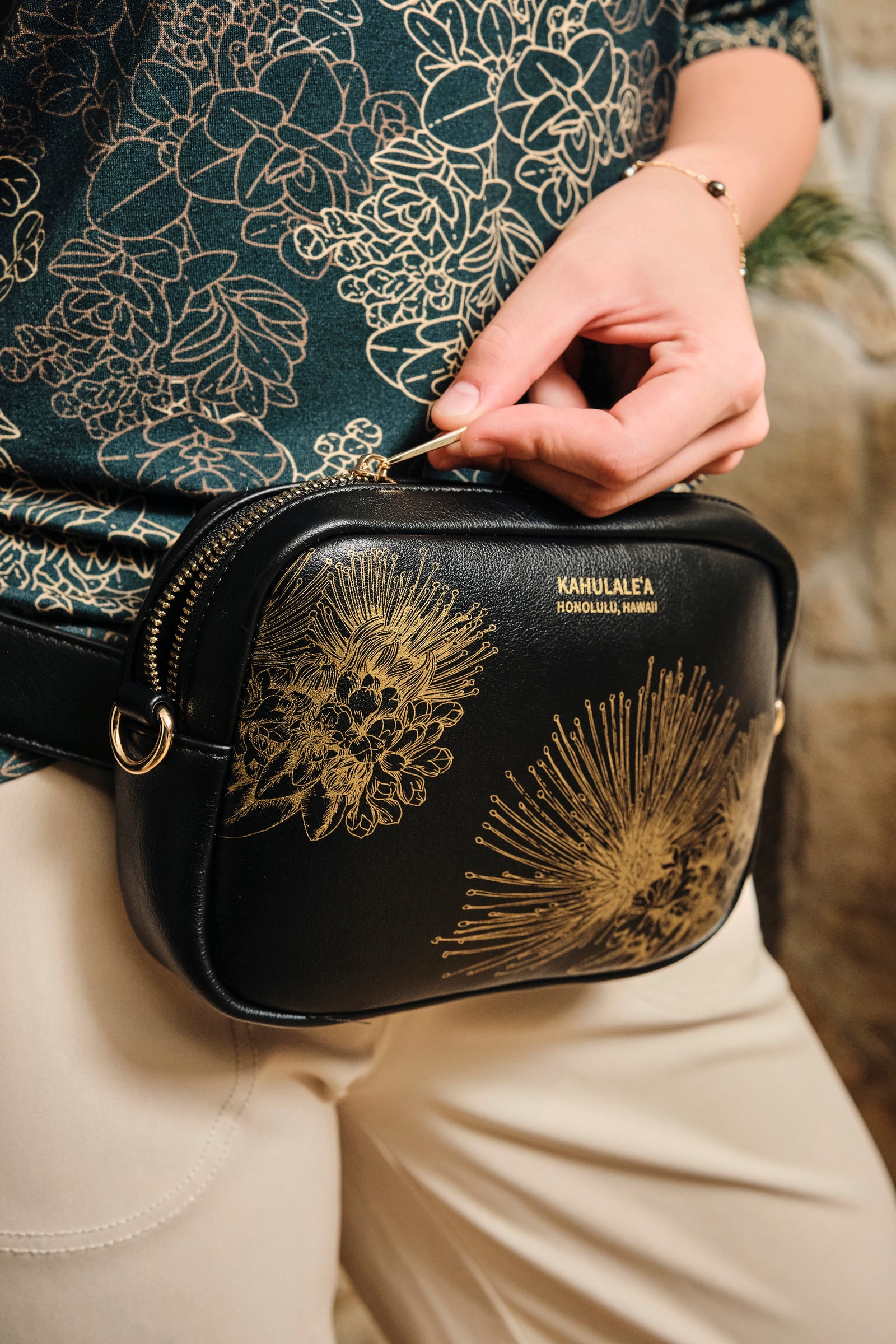 Close up view of the Waist Pack in Black/Gold Hopoelehuaopuna print by Kahulaleʻa