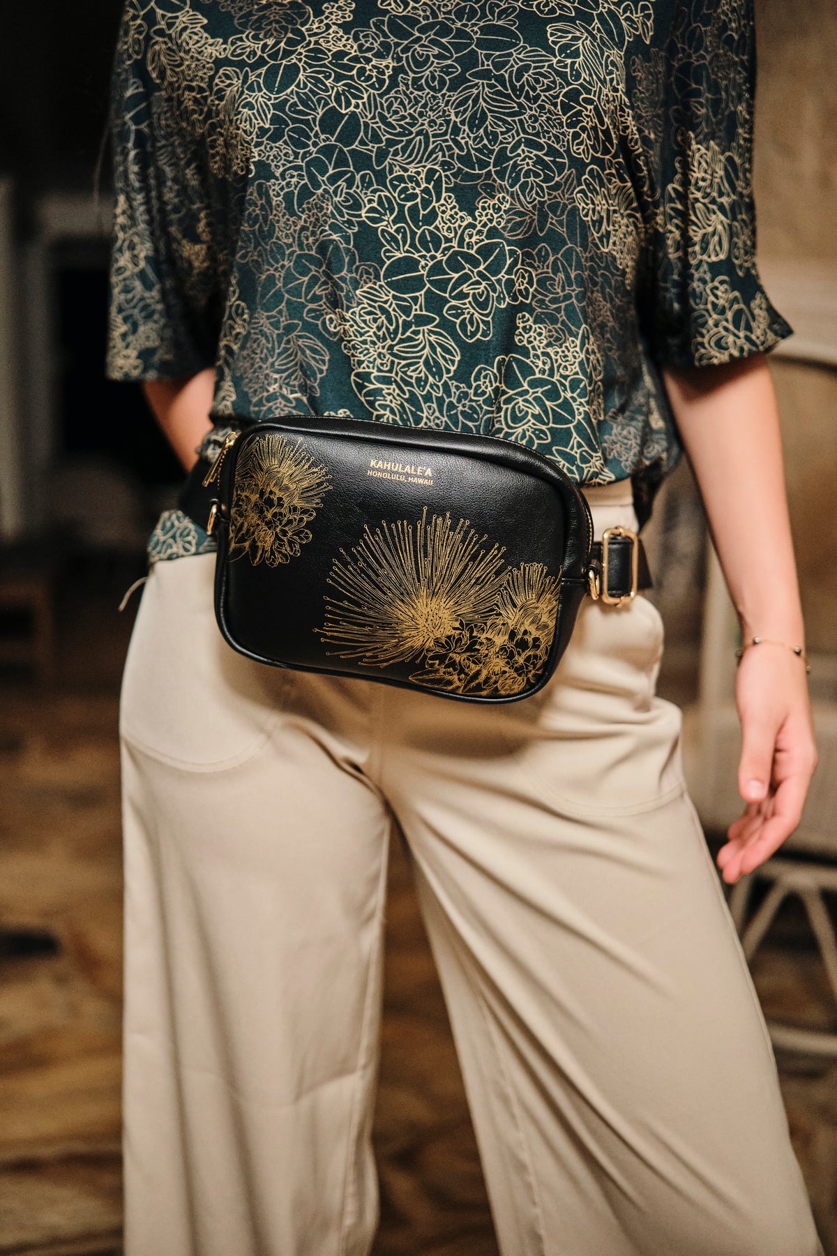 Front view of the Waist Pack in Black/Gold Hopoelehuaopuna print by Kahulaleʻa