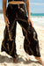 Pants Kōkeʻe Black Gold Lei Puakenikeni