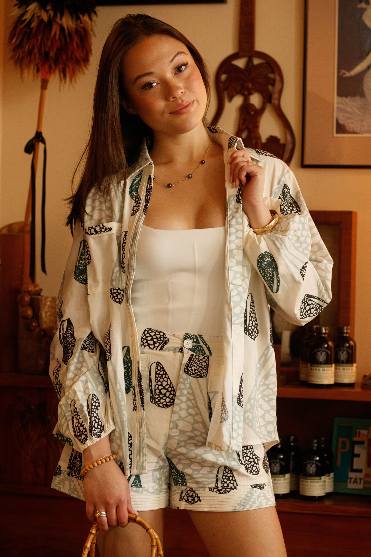 Top Poʻokela in Butter Pūpū Ala — Front View, worn open with the Shorts Heʻe Nalu | Kahulaleʻa
